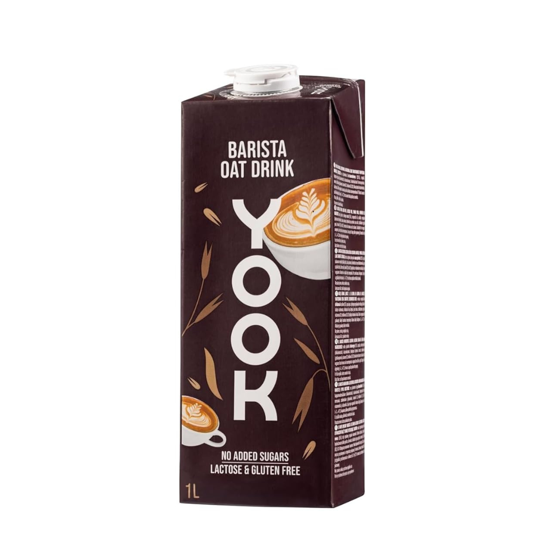 A 1-liter carton of Yook Barista Oat Drink in dark brown packaging with white and beige graphics, shown on a plain white background.
