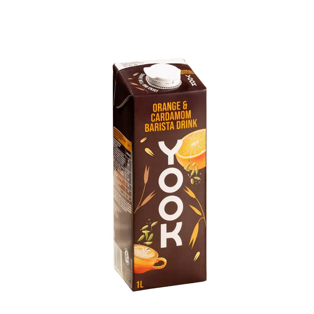 A 1L carton of Yook Orange & Cardamom Barista Drink, featuring a dark brown design with illustrations of an orange slice, cardamom pods, and a cup of coffee, on a solid white background.