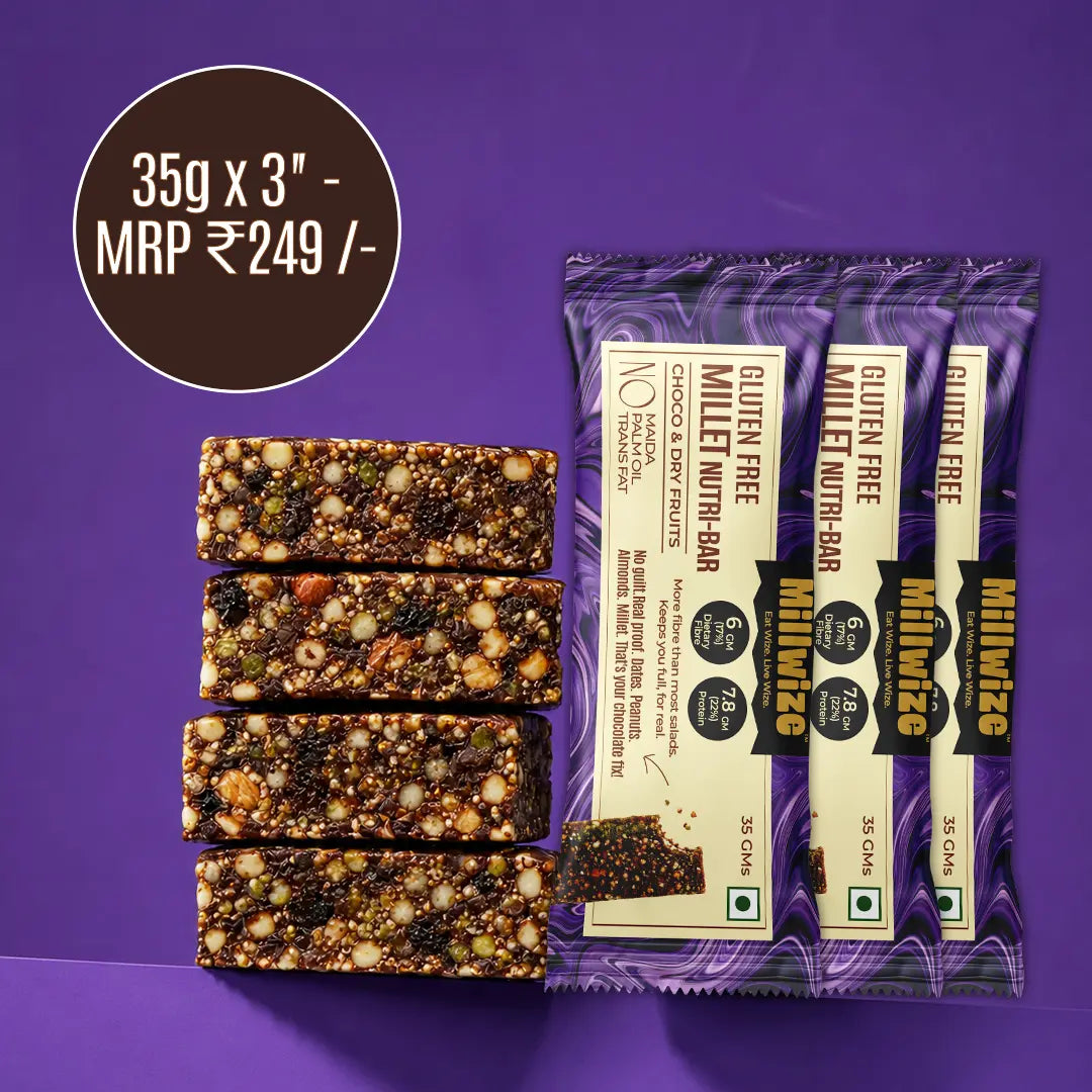 Four chocolate-free gluten free nut and seed energy bars displayed next to their purple and beige packaging wrappers, with a dark brown promotional price circle overlay on a solid purple background.